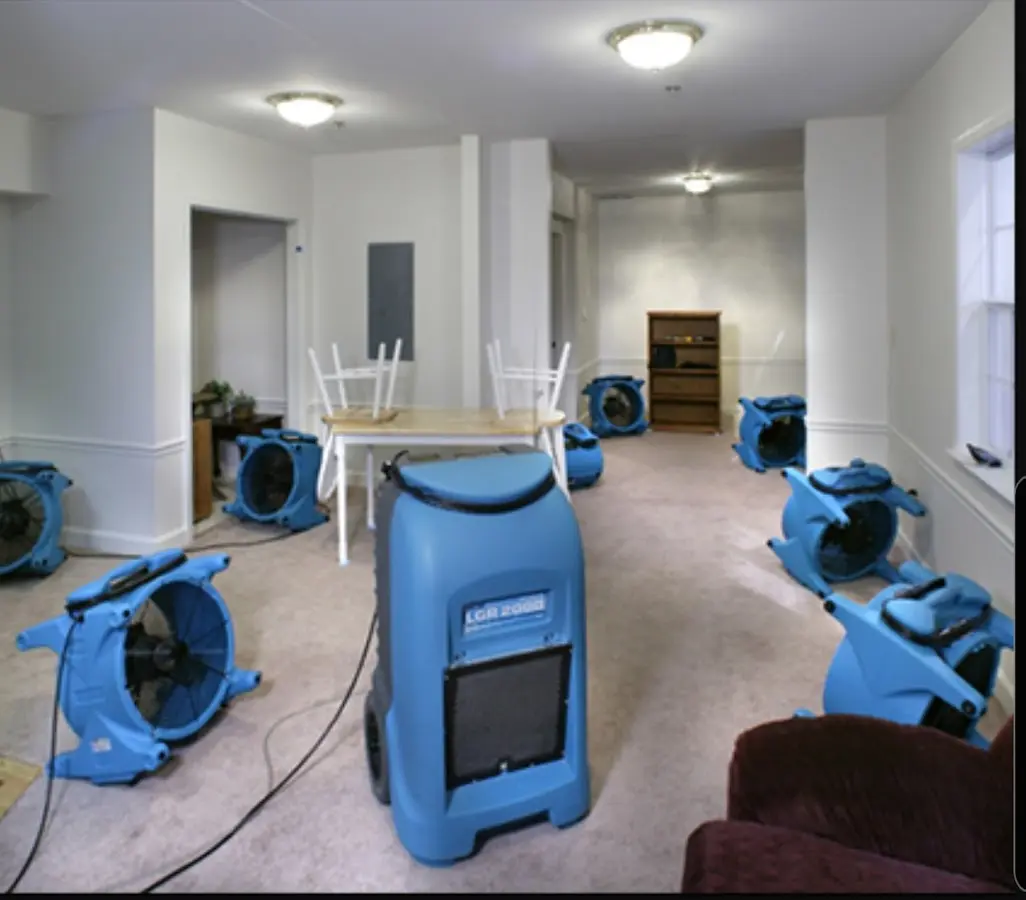 Air movers and dehumidifier setup for Water Damage Restoration in Volney